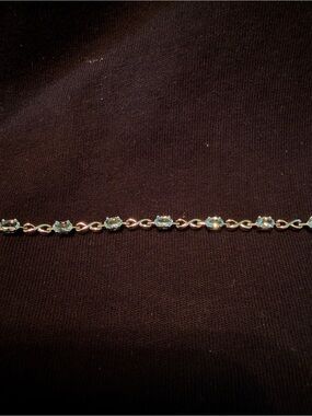 Sterling Silver Tennis Bracelet with Light Blue Stones and Infinity Shaped Links